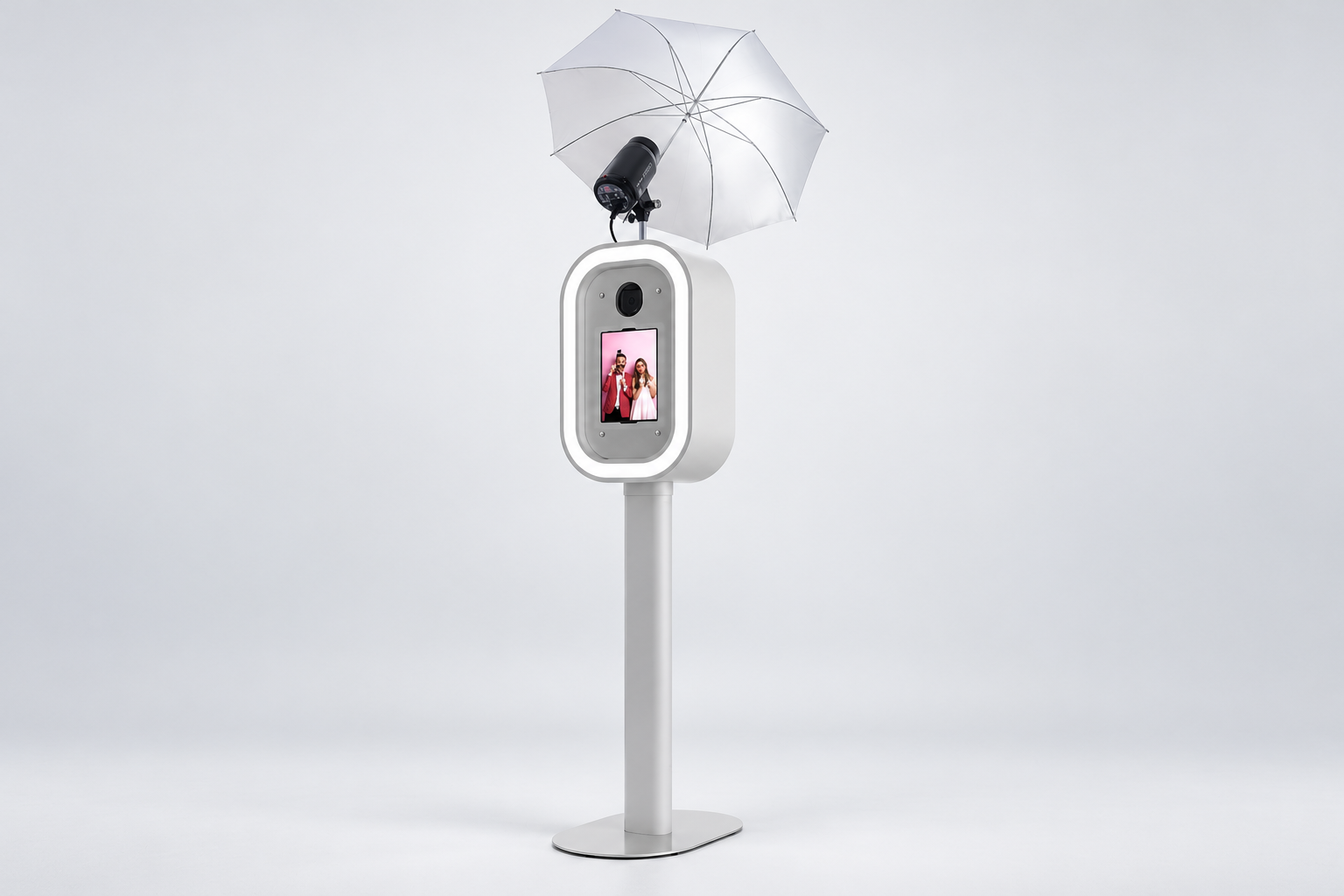 White DSLR photo booth with touchscreen, umbrella, and flash